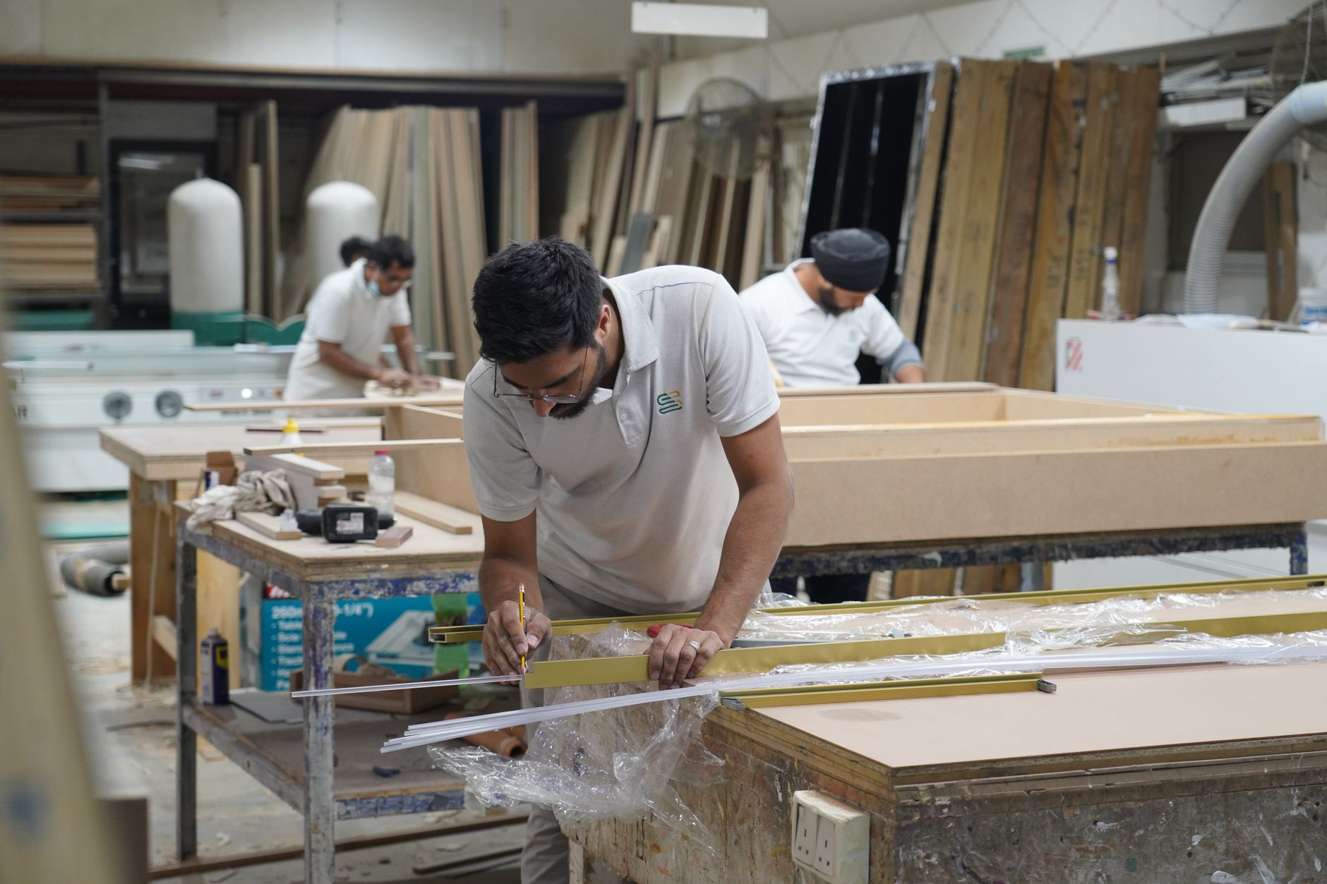 skilled carpenters at work in dubai workshop