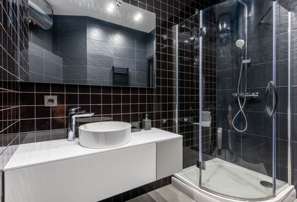 sink and shower unit in bathroom