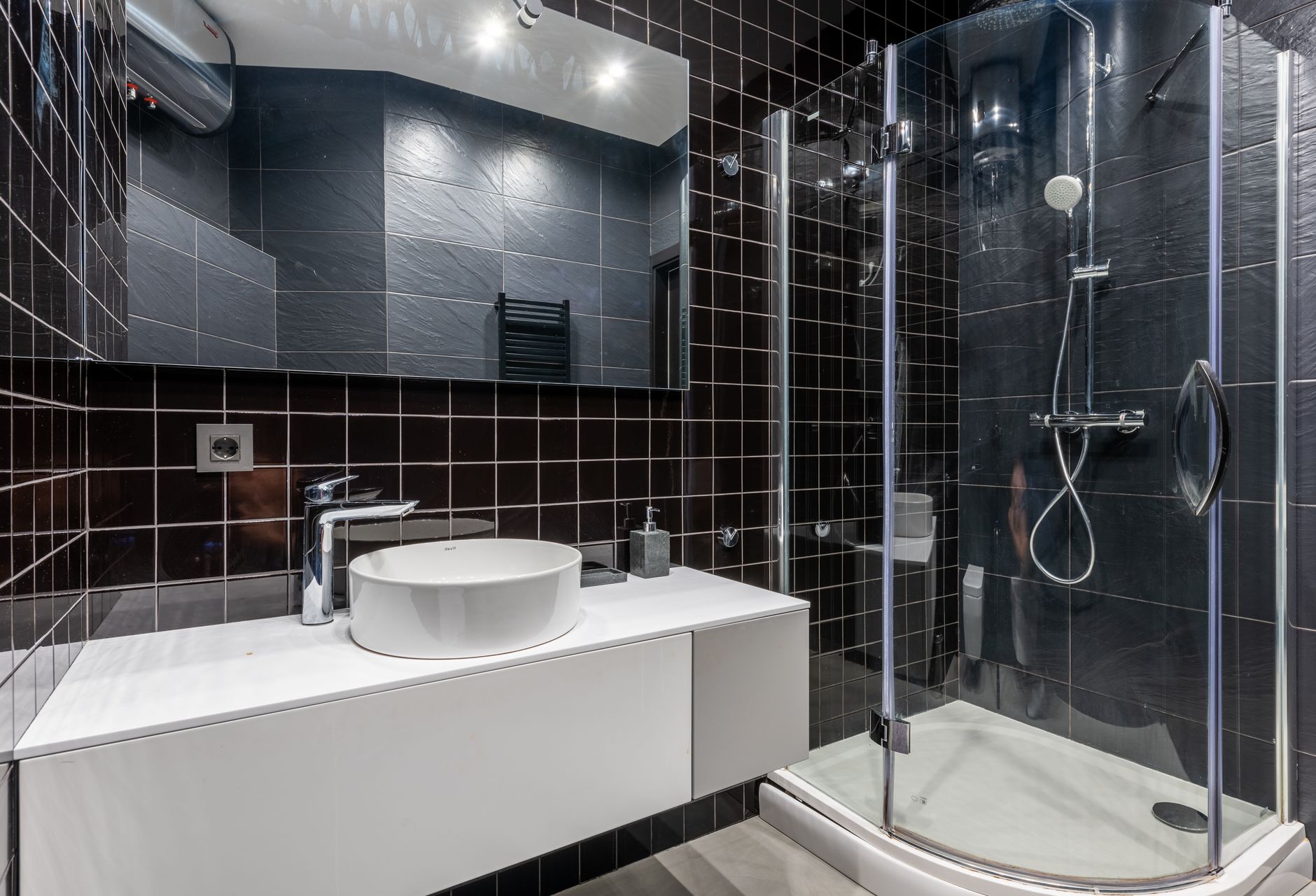 sink and shower unit in bathroom